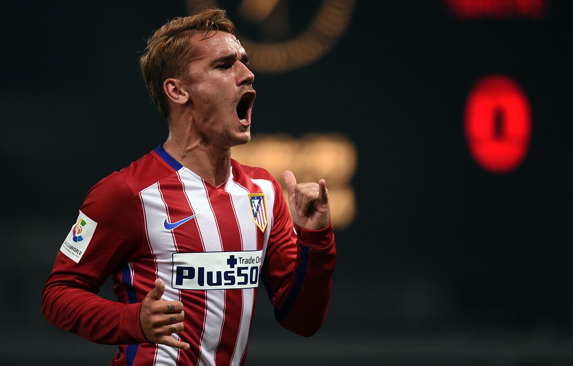 Atletico Madrids French forward Antoine Griezmann celebrates his goal during a friendly football match between Shanghai SIPG and Atletico Madrid in Shanghai on August 4, 2015. AFP PHOTO / JOHANNES EISELE (Photo by JOHANNES EISELE / AFP)