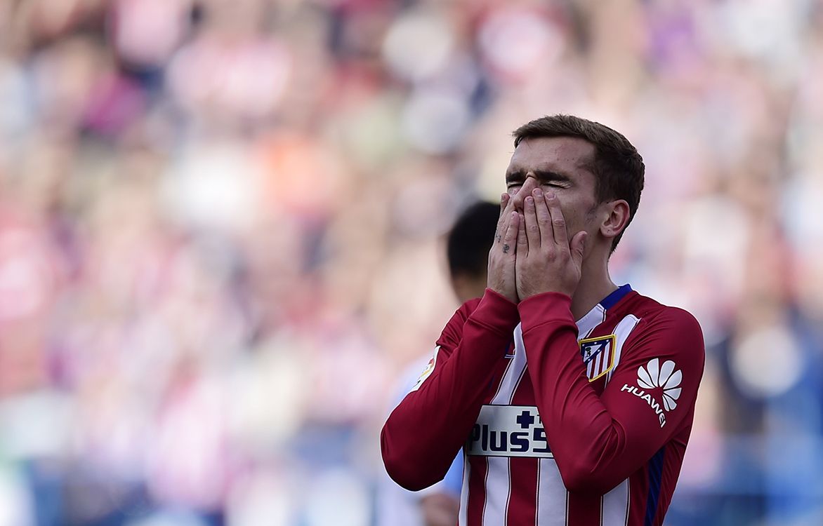 Atletico Madrids French forward Antoine Griezmann gestures during the Spanish league football match Club Atletico de Madrid vs Malaga CF at the Vicente Calderon stadium in Madrid on April 23, 2016. (Photo by JAVIER SORIANO / AFP)