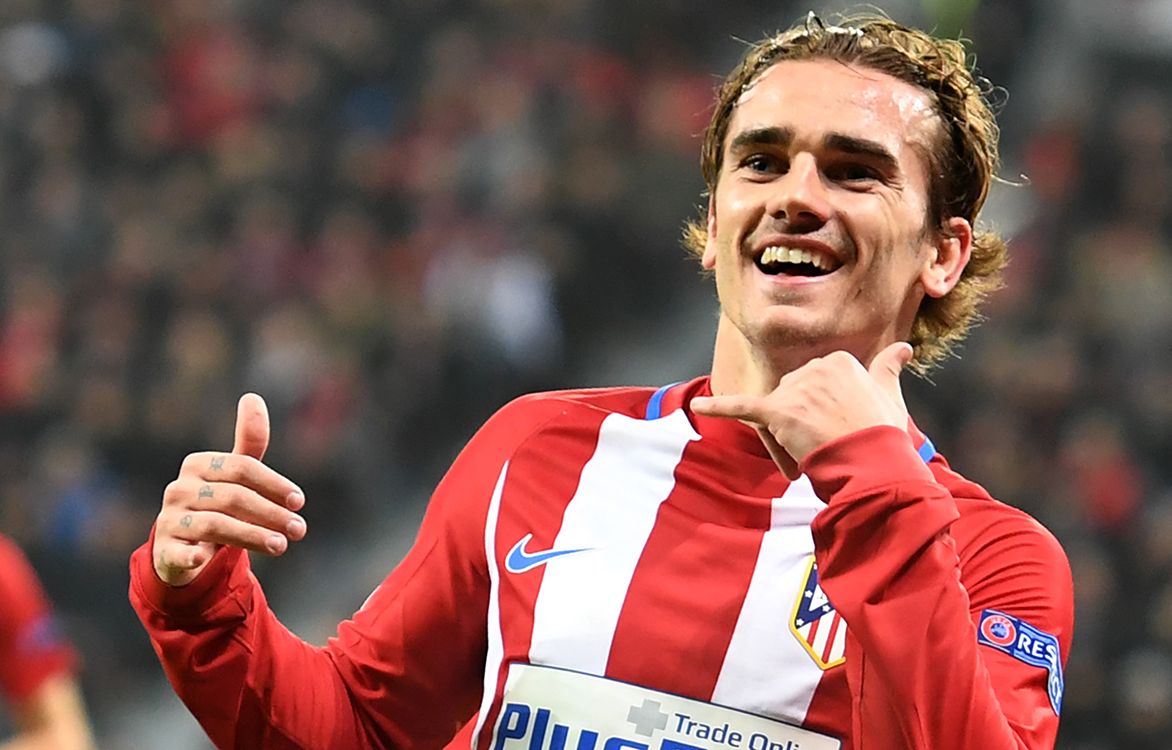 Atletico Madrids French forward Antoine Griezmann celebrate after scoring the 0-2 goal during the UEFA Champions League round of 16 first-leg football match between Bayer 04 Leverkusen and Club Atletico de Madrid in Leverkusen, western Germany on February 21, 2017. (Photo by Federico Gambarini / dpa / AFP) / Germany OUT