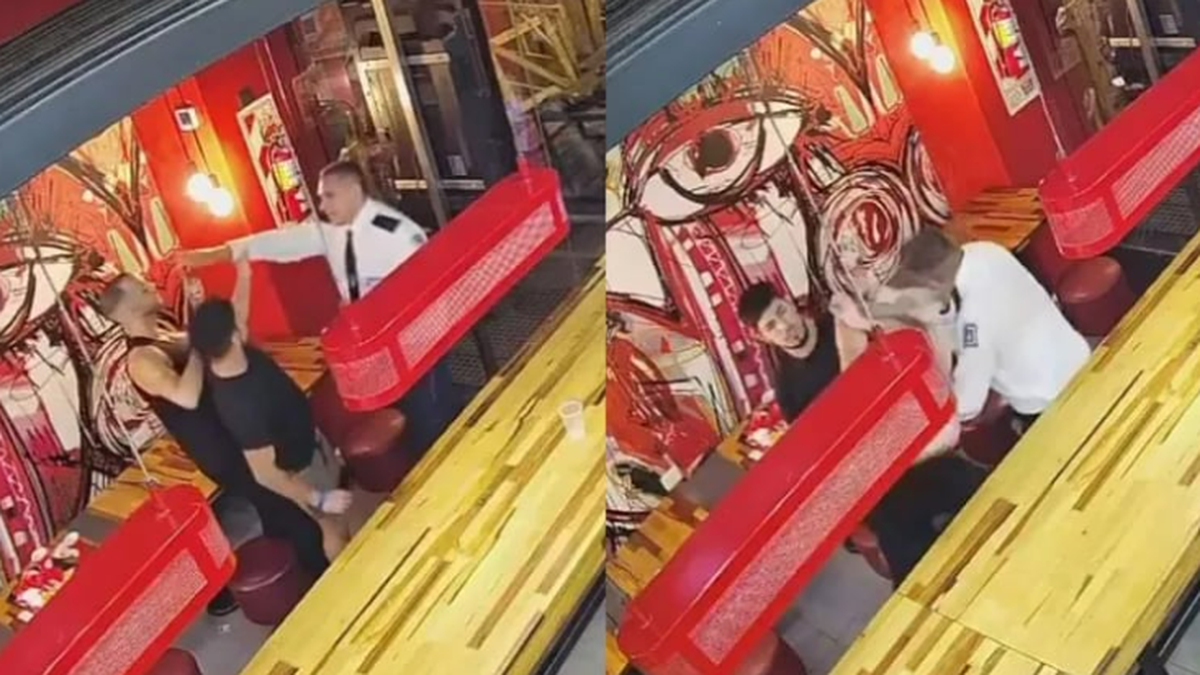 El momento de la agresión alos jóvenes en el local de comidas rápidas. (Foto: captura video)