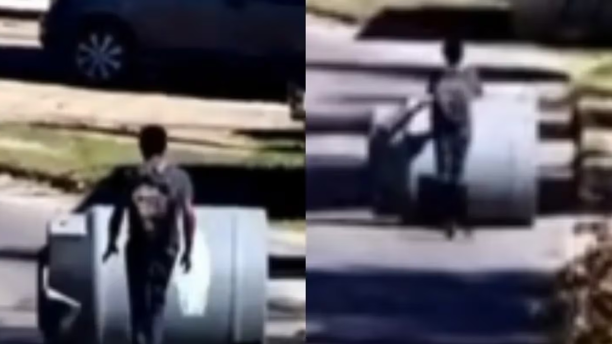 Un delincuente robó un tanque de agua y se lo llevó rodando por la calle. (Foto: captura)